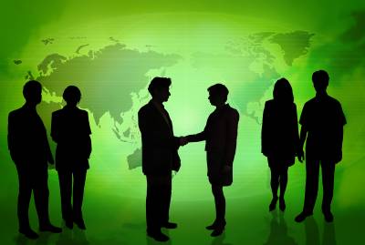 Business People In Front Of A Green Map Background Thumbnail