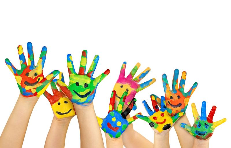 Many painted colorful childrens hands powerpoint background