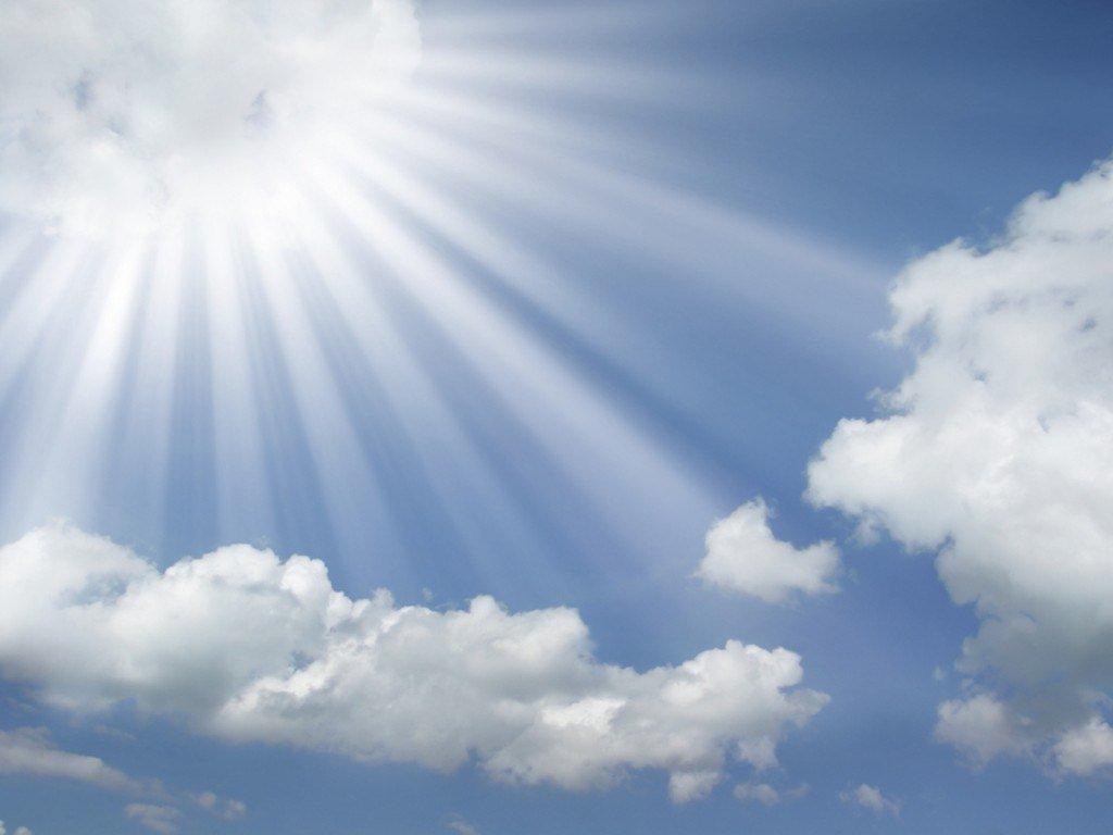 Sun rays coming out of the clouds powerpoint background